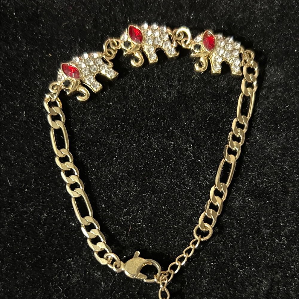 Elegant Gold Elephant Bracelet with Red Gems